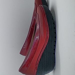 Fly London red leather slip-on wedges.